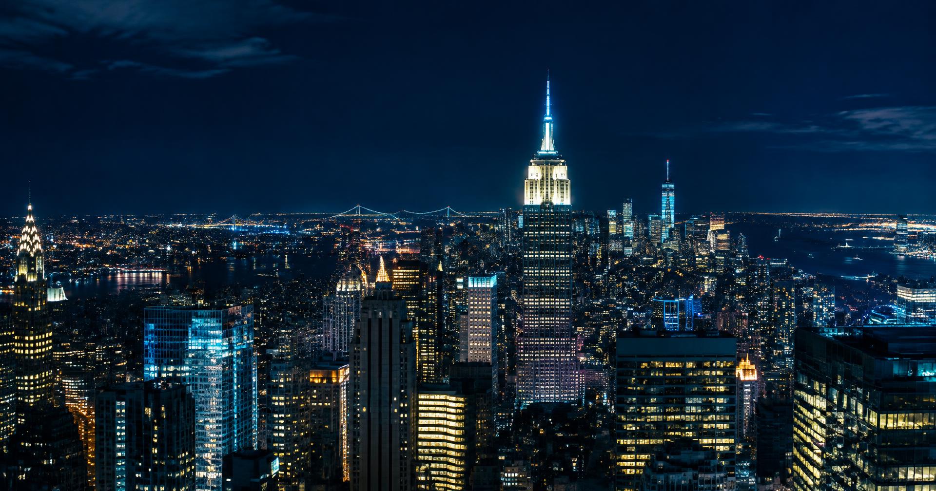 Manhattan skyline glowing at night